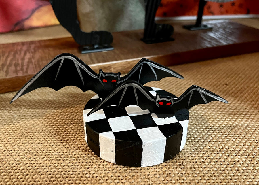 Bats Table Topper on Checked Base